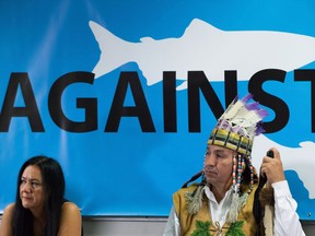 Cheryl Bear, left, a councillor with the Nadleh Whut'en First Nation, and Hereditary Chief Pete Erickson of the Nak'azdli First Nation listen during a news conference about the Enbridge Northern Gateway pipeline in Vancouver on Oct. 1, 2015. The Federal Court of Appeal says Canada failed in its duty to consult with aboriginal people before giving the green light to a controversial pipeline proposal to link Alberta's oilsands to British Columbia's north coast.