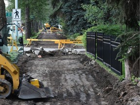 Construction crews put in a shared-use pathway along 102 Avenue.