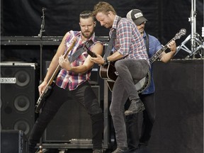 Dierks Bentley (right) performs with his band on the main stage at Big Valley Jamboree 2016 in Camrose, Alberta on Friday, July 29, 2016.