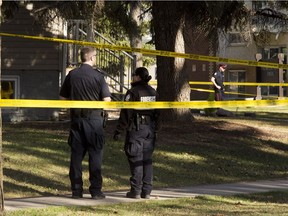 A photo from April 18, 2016, shows police investigating the death of a 30-year-old woman in the area of 117th Avenue and 128th St.