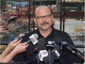 Oilers GM Peter Chiarelli speaks during a press conference in Edmonton July 1, 2016.