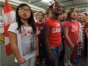 Students from Lago Lindo school sing O Canada in 2015 as Rob Hanson, executive director of Hometown Music, records their efforts.