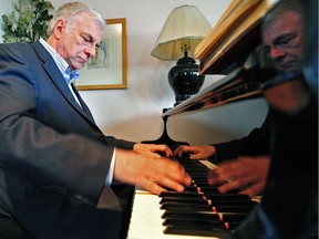 Pianist and conductor Michael Massey, pictured in a 2014 photo, is one of two Edmonton-area music legends being honoured for their decades of contributions to the arts.