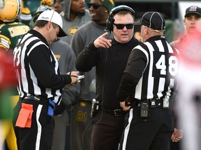 Edmonton Eskimos head coach Chris Jones talking with the referees against the Calgary Stampeders during the CFL Western Final at Commonwealth Stadium in Edmonton, November 22, 2015.