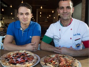 Buco co-owner Antonio Rago (left) and chef Carlo Raillo showcase Neapolitan pizza at the St. Albert eatery.