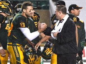 EDMONTON, ALTA: SEPTEMBER 12, 2015 -- Edmonton Eskimos QB Mike Reilly and head coach Chris Jones celebrate their win against the Calgary Stampeders 27 - 16 during CFL action at Commonwealth Stadium in Edmonton,  September 12, 2015. (ED KAISER/EDMONTON JOURNAL)