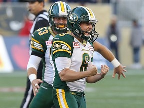Edmonton Eskimos kicker Sean Whyte (top) celebrates a 53-yard field goal on the final play of the game to beat the Winnipeg Blue Bombers during CFL action at Investors Group Field in Winnipeg on Sat., Oct. 3, 2015. Kevin King/Winnipeg Sun/Postmedia Network
