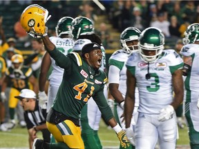 Edmonton Eskimos Odell Willis (41) celebrates defeating the  Saskatchewan Roughriders in overtime as they stopped them on a third down try during CFL action at Commonwealth Stadium in Edmonton, Saturday, July 8, 2016.