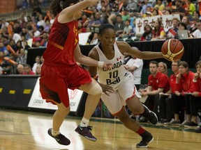Canada's Nirra Fields (10) battles China's Chen Xiao-jia (7) during Game 2 of the Edmonton Grads International Classic at the Saville Centre in Edmonton on Sunday, July 10, 2016.