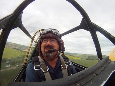 Yellow Thunder pilot David Watson gives a ride to Edmonton Journal reporter Juris Graney in his Harvard airplane from Villeneuve Airport ahead of the Edmonton Air Show in Sturgeon County, on Thursday, July 21, 2016.