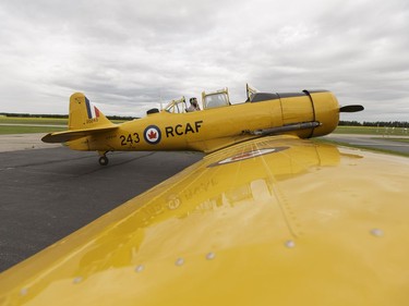 Yellow Thunder pilot David Watson (right) gives a ride to Edmonton Journal reporter Juris Graney in his Harvard airplane from Villeneuve Airport ahead of the Edmonton Air Show in Sturgeon County, on Thursday, July 21, 2016.