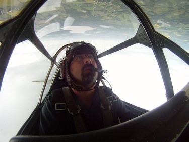 Yellow Thunder pilot David Watson gives a ride to Edmonton Journal reporter Juris Graney in his Harvard airplane from Villeneuve Airport ahead of the Edmonton Air Show in Sturgeon County, on Thursday, July 21, 2016.