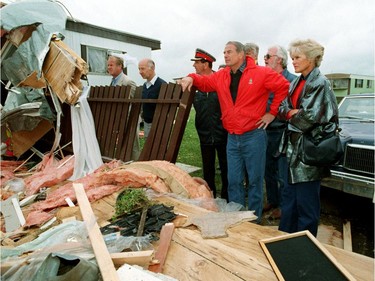 Alberta premier Don Getty (in red) and his wife, Margaret toured the devastation at the Evergreen Mobile Home Park after a massive tornado hit Edmonton on Friday July 31, 1987.