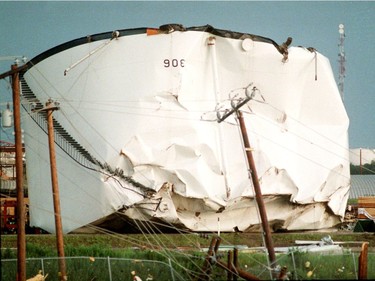 A oil tank is seen flipped over on refinery row off of Baseline Rd., after a massive tornado hit Edmonton on Friday July 31, 1987.