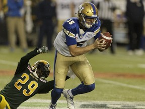 Edmonton's Cord Parks (29) misses a sack on Winnipeg quarterback Matt Nichols (15) during the first half of a CFL football game between the Edmonton Eskimos and the Winnipeg Blue Bombers at Commonwealth Stadium in Edmonton, on Thursday, July 28, 2016. Ian Kucerak / Postmedia (For Edmonton Journal/Sun story by Gerry Moddejonge) Photos for stories, columns off Eskimos game appearing in Friday, July 29 edition.