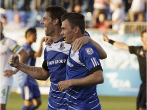 Edmonton's Daryl Fordyce (16) celebrates Nik Ledgerwood's (6) goal during NASL soccer play between FC Edmonton and the New York Cosmos at Clarke Stadium in Edmonton, on Wednesday, July 27, 2016. Ian Kucerak / Postmedia (For Edmonton Journal/Sun story by Derek Van Diest) For Derek Van Diest game story running Thursday, July 29.