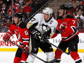 When he was with a member of New Jersey Devils, Mark Fayne (#7) played a lot with Andy Greene (#6), seeing plenty of tough competition such as #87 in white here.