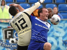 FC Edmonton Albert Watson (5) is tangled up by Fort Lauderdale Strikers keeper Diego Restrepo (17) during action in NASL at Clarke Stadium in Edmonton, Sunday, July 10, 2016. Ed Kaiser/Postmedia (Standalone) Photo off FC Edmonton game for Derek Van Diest story in Monday, July 11, editions.