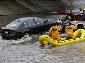 Fire rescue had to perform a water rescue on Whitemud Drive under 111 Street early Saturday evening as heavy rains in the Edmonton area caused flooding in the region.