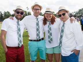 Ryan Kelly, left, Dan Nielsen, Cheryl Oxford and Bin Lau pose for a photo during Lawn Summer Nights at Commonwealth Lawn Bowling Club in Edmonton on Thursday, July 7, 2016
