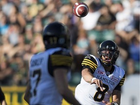 Hamilton Tiger-Cats Jeremiah Masoli (8) throws to Luke Tasker (17) during second half action against the Edmonton Eskimos at Commonwealth Stadium on Saturday, July 23, 2016 in Edmonton. Greg Southam / Postmedia Photos for various stories, columns (Gerry Moddejonge, terry Jones, Dan Barnes) running in Sunday, July 24 edition.