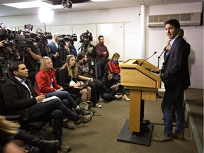 Prime Minister Justin Trudeau speaks with media in Edmonton, on May 13, 2016, after a visit to the devastated area of Fort McMurray. Trudeau says the government is extending employment insurance benefits to three western economic regions that were left out when changes were first made. Those changes took effect in mid-July 2016.