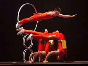 Members of the Peking Acrobats perform at K-Days. The group has three more shows on Sunday.