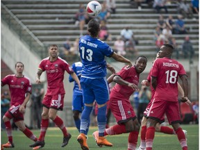 Karsten Smith of FC Edmonton, goes up to head the ball against the Ottawa Fury at Clark Stadium on July 17, 2016, in Edmonton. Smith was thrust into action just hours after meeting his new teammates due to defender Papé Diakité being ejected for two yellow cards.