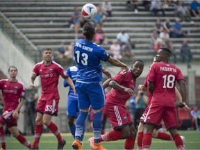 Karsten Wen-Smith of FC Edmonton, tries to head the ball towards the net against the Ottawa Fury in NASL action at Clark Park on July 17, 2016 in Edmonton.