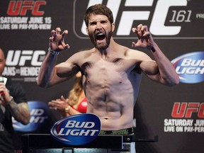 Lightweight Mitch (Danger Zone) Clarke makes weight during the UFC 161 weigh-in in Winnipeg, Man. on Friday June 14, 2013. Fifteen months after losing a unanimous decision to Michael Chiesa, Canadian lightweight Mitch (Danger Zone) Clarke returns to action Thursday at a UFC show in Las Vegas. The Saskatoon native, who fights out of Edmonton, had the worst of the first two rounds against Chiesa but rallied in the third with some solid striking. Lessons were learned, Clarke said.