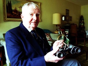 Gord King, photographed in 1991, with binoculars taken from a German prisoner during the Second World War.
