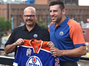 Newly acquired forward, Oiler Milan Lucic and GM Peter Chiarelli before talking to the media in Edmonton, Friday, July 1, 2016. Ed Kaiser/Postmedia
