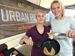 Magdalena Celejowska (R) and Angela Billingsley, owners of Urban Pierogies, have a booth with gourmet perogies at the Southwest Edmonton Farmers Market.