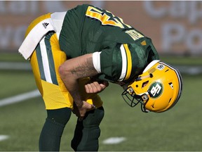 Edmonton Eskimos quarterback Mike Reilly reacts after being sacked by the Hamilton Tiger-Cats during second half CFL action in Edmonton, Alta., on Saturday July 23, 2016. Hamilton overcame a 25-point deficit to win 37-31.