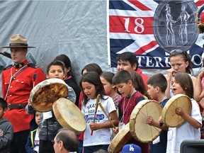 Children drum and sing traditional Cree songs before federal ministers Carolyn Bennett and Amarjeet Sohi at Enoch Cree Nation  on Wednesday, July 20, 2016.