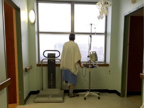 A patient looks out a window at the palliative care unit at St Mary's Hospital Centre in Montreal in 2015.