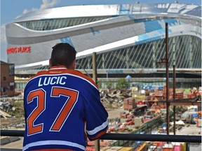 Newly acquired forward, Oiler Milan Lucic looks towards Rogers Place after talking to the media in Edmonton, Friday, July 1, 2016.