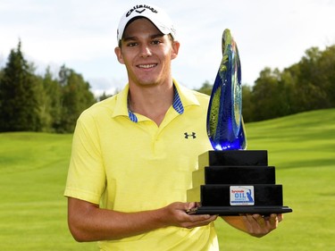 Aaron Wise poses with the winner's trophy after winning the Syncrude Oil Country Championship at the Glendale Golf & Country Club on July 31, 2016 in Edmonton.