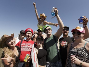 Partiers from Red Deer Alberta surround Mario and Lugi, a.k.a Dean and Kyle Colonna get into the BVJ spirit during Big Valley Jamboree 2016 in Camrose, Alberta on Friday, July 29, 2016.