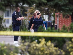 Police investigate the scene of an attempted armoured truck robbery at a TD Canada Trust branch at 25 Avenue and Hewes Way in Edmonton.