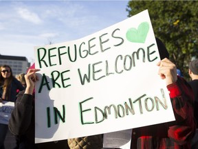 Supporters demonstrate during a Refugees Welcome rally held at the Alberta Legislature in Edmonton on Tuesday Sept. 8, 2015. More than 4,000 Syrian refugees now call Alberta home.