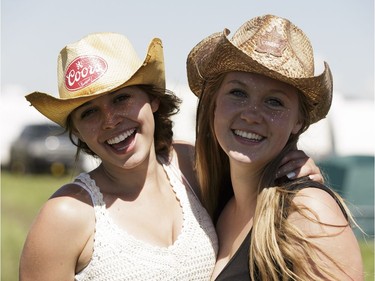 Sarah Antonishyn (left) and Kaylee O'Connor pose for a photo in the campsite during Big Valley Jamboree 2016 in Camrose, Alberta on Friday, July 29, 2016.