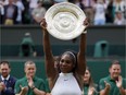 Serena Williams of the U.S holds up her trophy after winning the Wimbledon women's singles final against Angelique Kerber of Germany in London, Saturday, July 9, 2016.