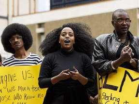 Demonstrators call for change during the Stop Killing Us rally held at Centennial Plaza in Edmonton, on Friday, July 8, 2016, in support of Black Lives Matter.