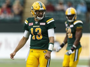 Edmonton's Mike Reilly (13) calls a play during a CFL game between the Edmonton Eskimos and the Ottawa Redblacks at the Brick Field at Commonwealth Stadium in Edmonton on Saturday, June 25, 2016. Ian Kucerak / Postmedia