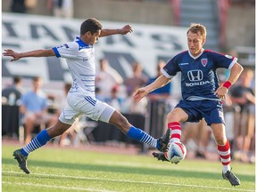 FC Edmonton midfielder Shamit Shome challenges Indy Eleven midfielder Brad Ring for the ball in NASL play on Sunday in Indianapolis. The Indy Eleven won 1-0.