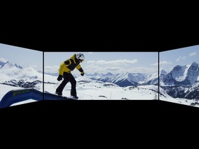 An example of the new Cineplex experience featuring Barco Escape, with two side screens creating a panoramic view.