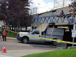 A Telus truck was damaged when a large piece of concrete fell on it after the truck struck the parkade at Londonderry Mall on July 15, 2016.