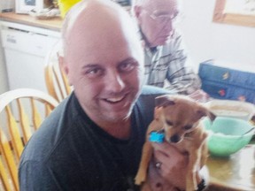Homicide victim Dwayne Demkiw seen with his dog Wallie in April 2015.