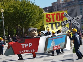Demonstrators hold a 2013 protes against the Trans-Pacific Partnership (TPP) on Pennsylvania Avenue, near the White House, in Washington, D.C.